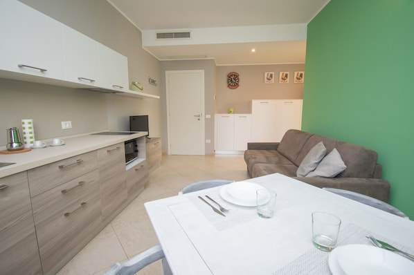 Apartment, 1 Bedroom (Girasole) | Private kitchen | Fridge, microwave, stovetop, coffee/tea maker