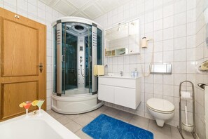 Bathtub, hair dryer, towels