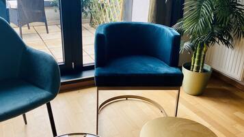 Executive Apartment | Living area | 55-inch Smart TV with cable channels, TV, Netflix