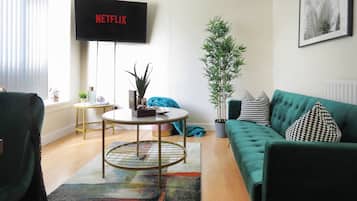 Deluxe Apartment | Living area | 49-inch Smart TV with cable channels, TV