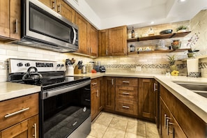 Enjoy cooking and dining in this well-organized kitchen with ample counter space and storage.