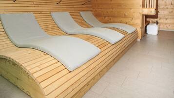 Relax on the curved bench with plush cushions and enjoy the serene atmosphere.