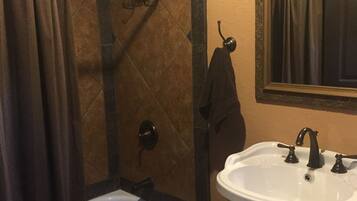 Combined shower/tub, hair dryer, towels, soap