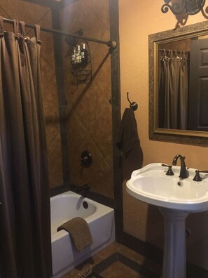 Combined shower/tub, hair dryer, towels, soap
