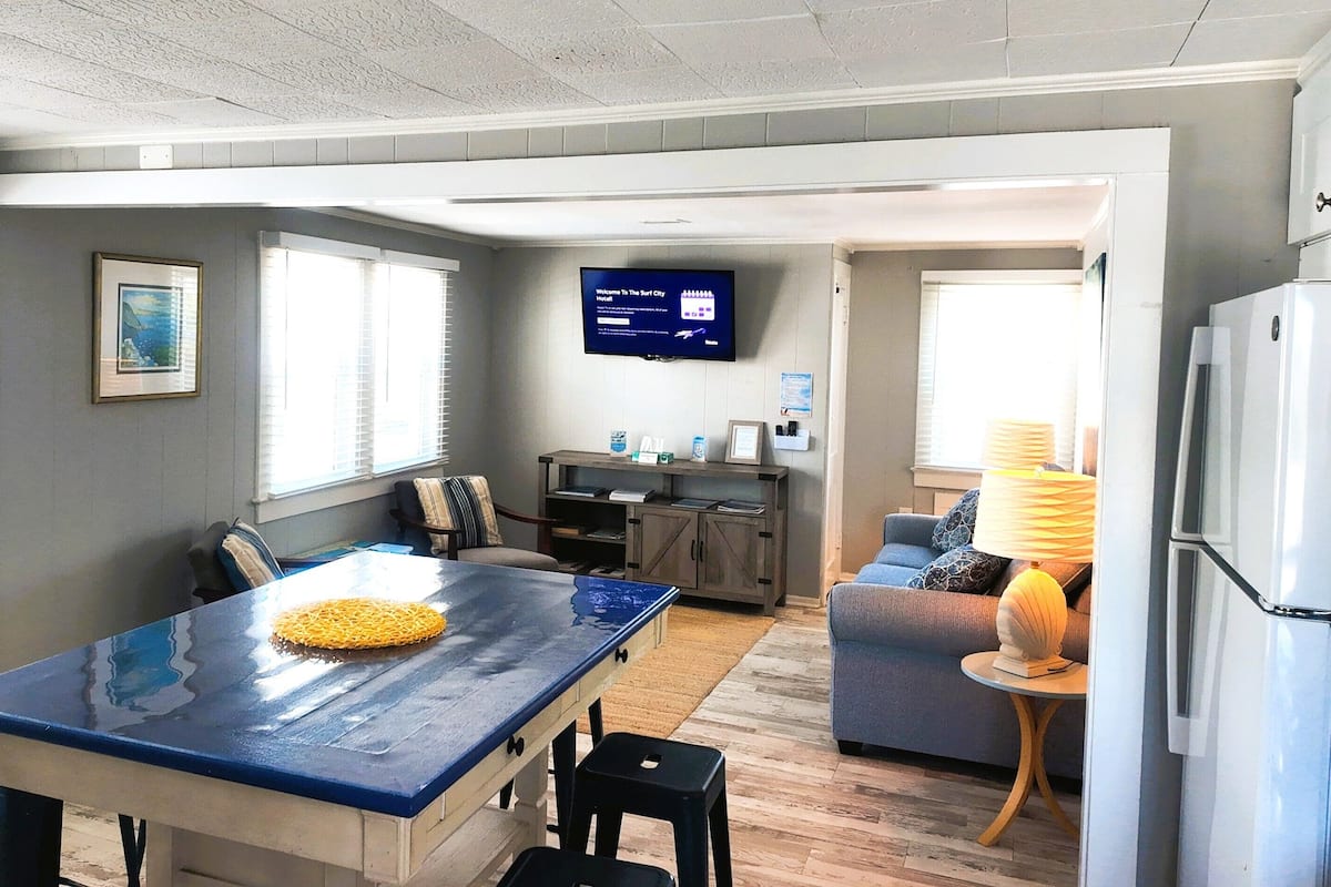 Deluxe 2 Bedroom Apartment Suite | Living area | 1-inch flat-screen TV with cable channels, TV