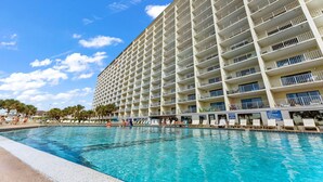 A large hotel with multiple balconies overlooking a swimming pool. - The Summit 1121 (Panama City Beach)