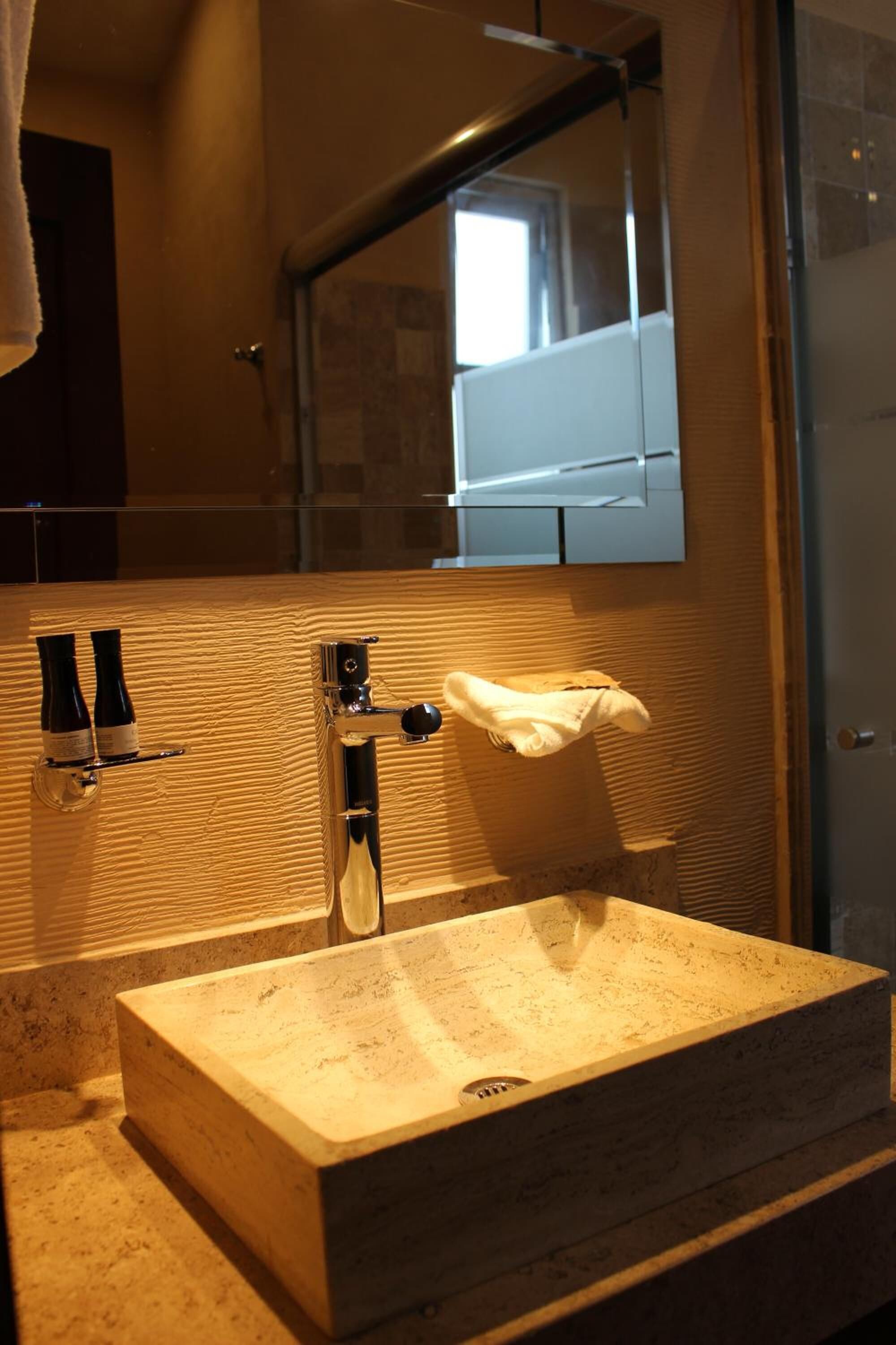 shower, rainfall showerhead, hair dryer, towels