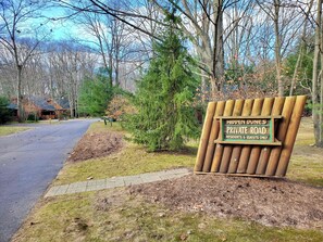 A private road sign for Hidden Dunes, indicating it is a private road for residents and guests only. - Wander Inn - Updated Log Cabin near shared beach (Saugatuck)