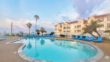 A heated pool, sun loungers