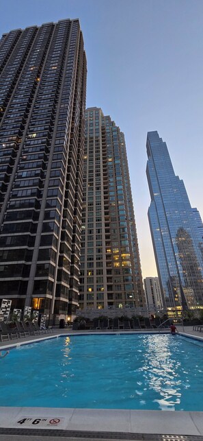 Outdoor pool, a heated pool - Luxury 1BR Condo – Views, Comfort, & Style (Chicago)