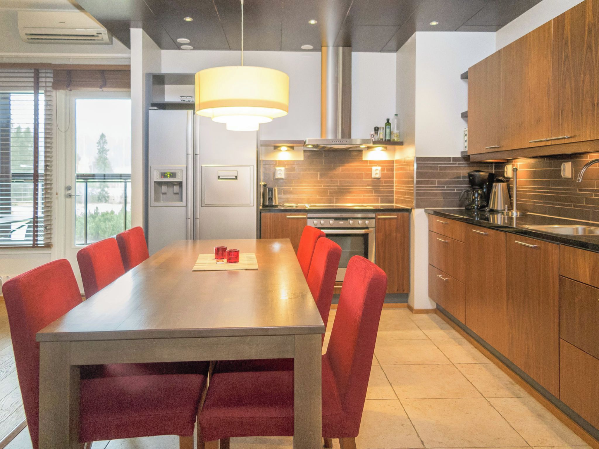 A modern kitchen with a dining area.