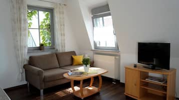 Comfort Condo | Living room | 30-inch flat-screen TV with cable channels, TV