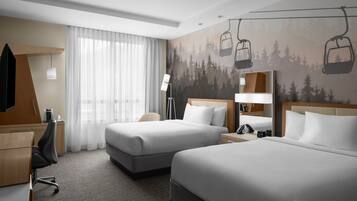 Luxe beddengoed, donzen dekbedden, pillowtop-bedden, een bureau