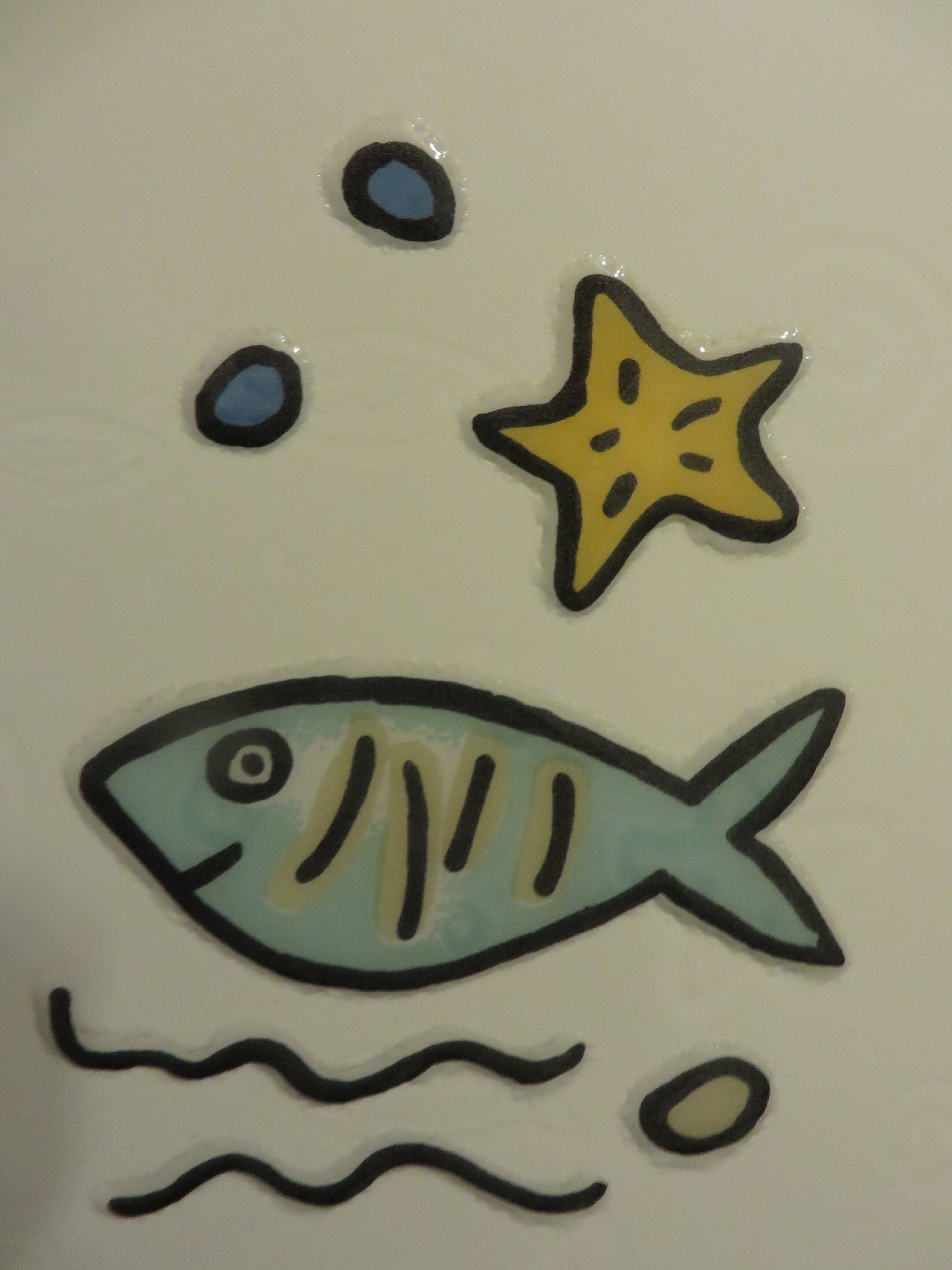 A fish with a star above it, surrounded by bubbles.