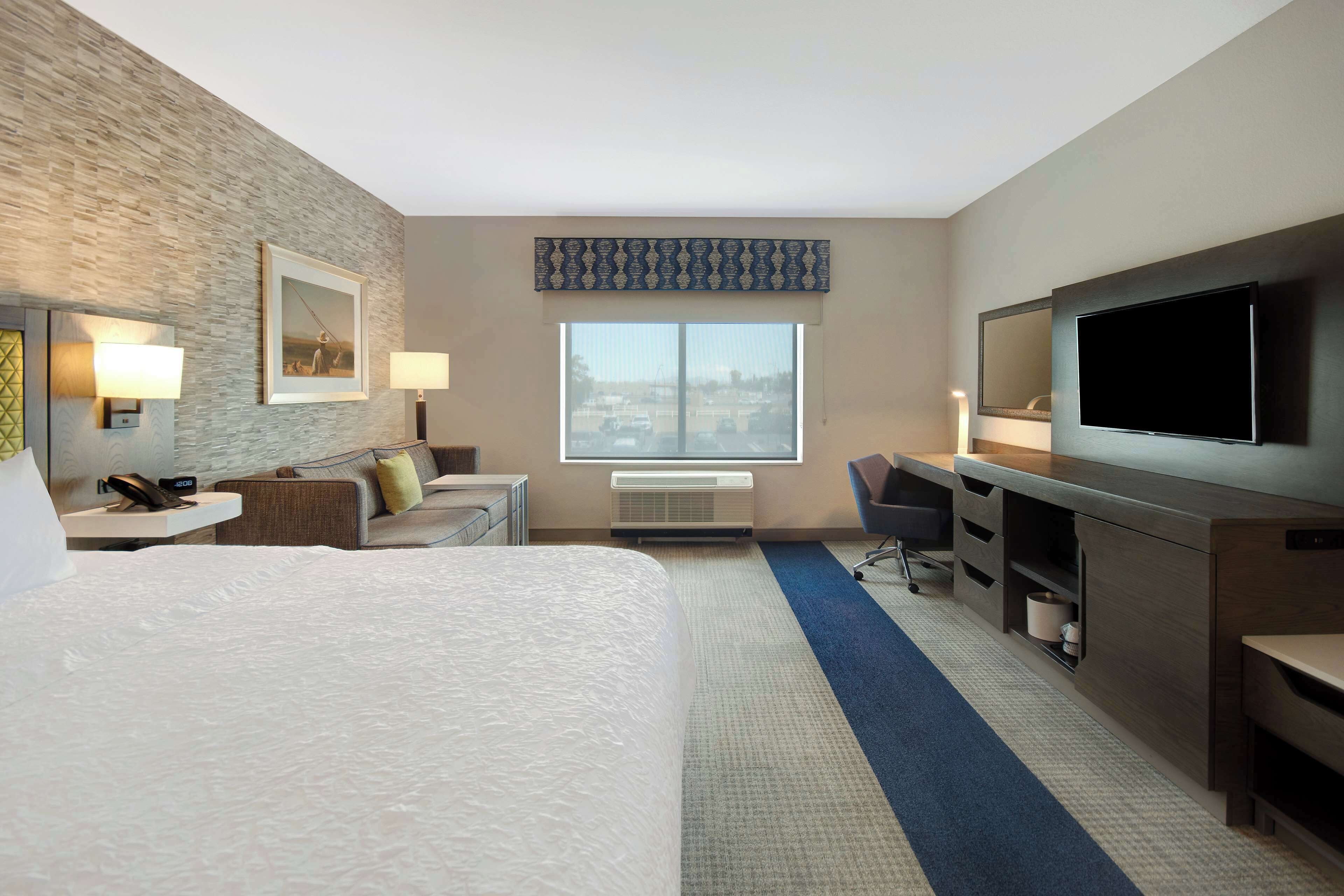 room, 1 king bed with sofa bed, refrigerator & microwave | blackout curtains, iron/ironing board