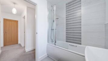 Bathtub, hair dryer, towels