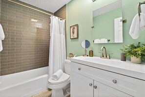 Shower, hair dryer, towels, shampoo