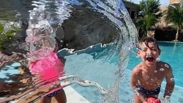Outdoor pool, open 10:00 AM to 8:00 PM, pool loungers