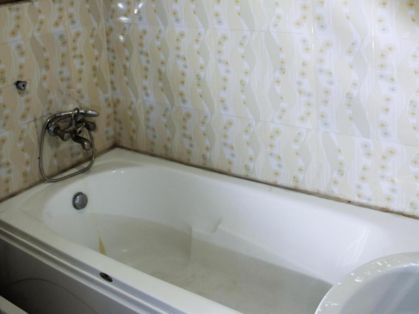 A bathroom with a bathtub, a shower, and a toilet.
