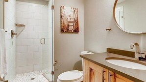 A bathroom with a shower, toilet, sink, and a mirror. - Steps from Main St, quiet 2-bdrm condo w/views, fireplace, hot tub, steam shower (Frisco)