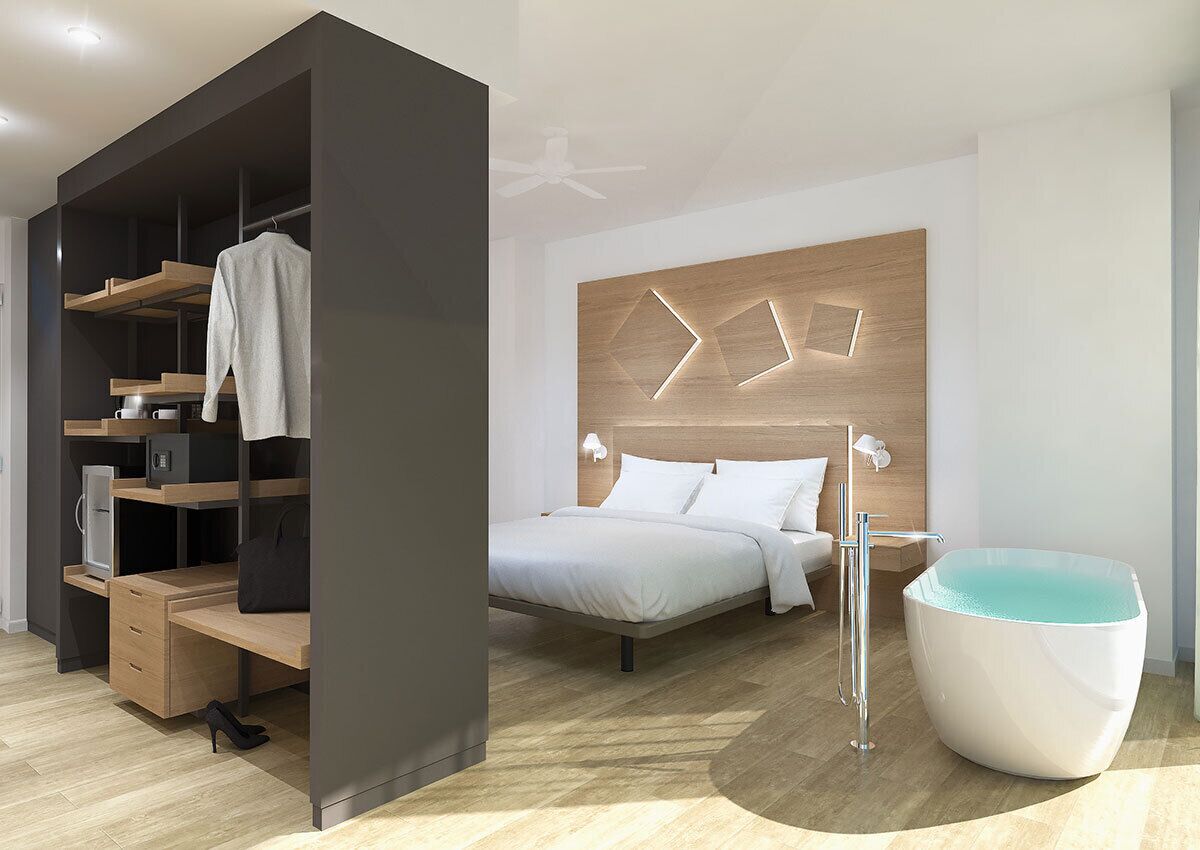 A modern bedroom with a bed, a built-in wardrobe, a desk, and a bathtub.