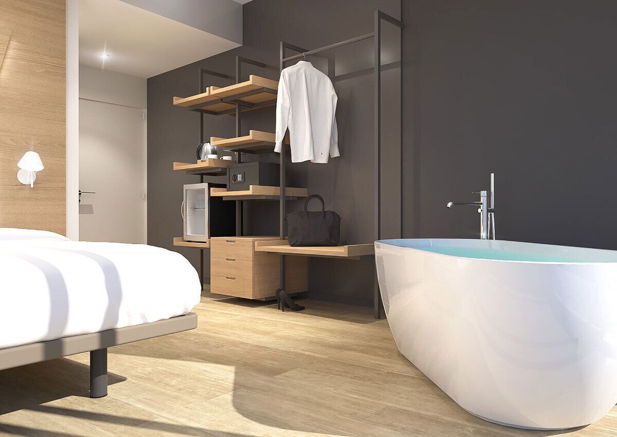 Un dormitorio moderno con una cama, un escritorio, un armario y una bañera grande.
