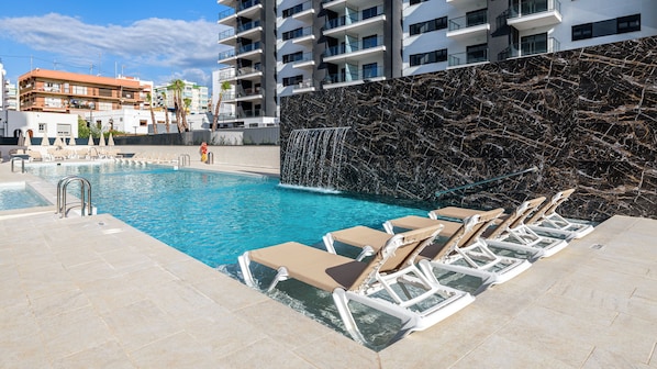 Seasonal outdoor pool, pool loungers