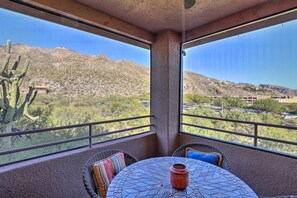 Enjoy breathtaking views of the surrounding mountains from this room's expansive window.