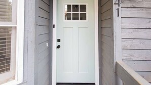 A white door with a small window above it, set in a wooden exterior. - *NEW* Cozy, Smart Condo| 10 mins to DT, Biltmore (Asheville)