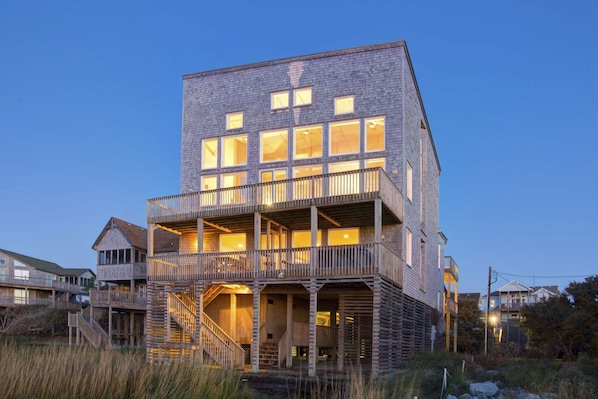 Stunning multi-story building with a charming balcony and rustic facade.
