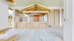A wooden structure with a sign reading 'Enjoy the View' and a 'FIND A BAR' sign above it.