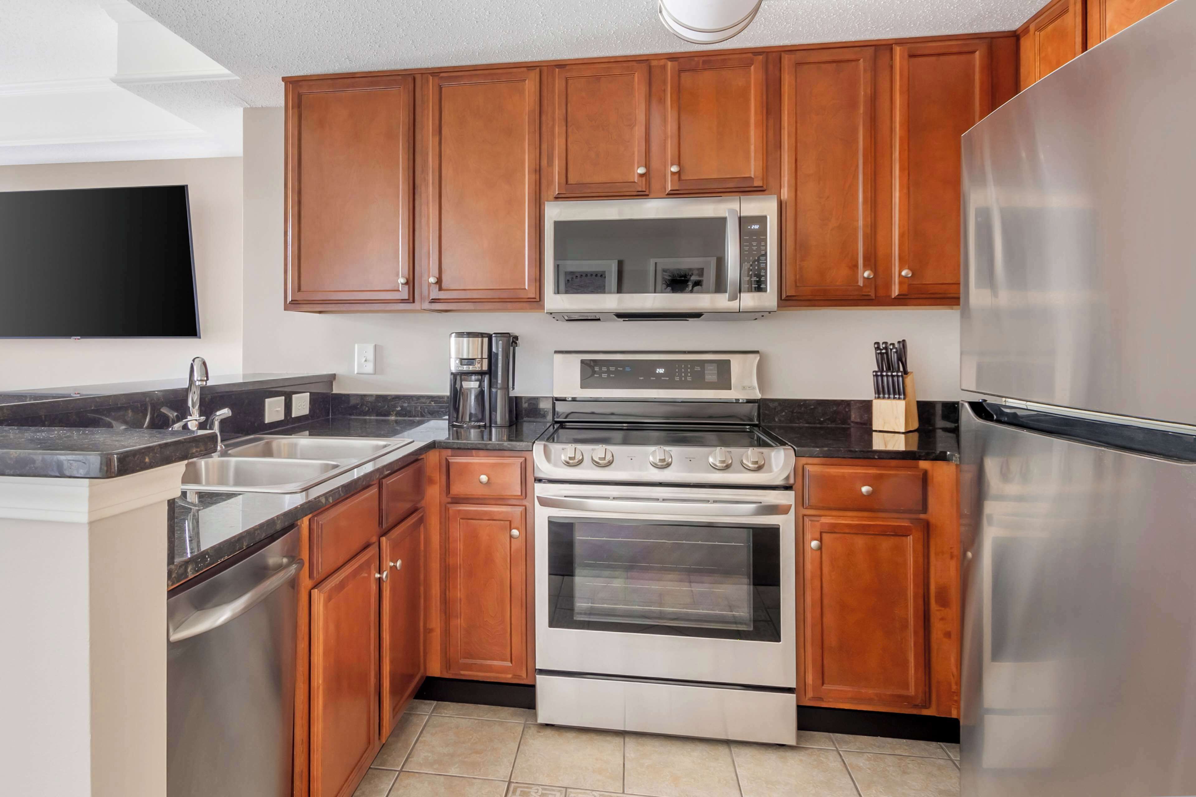 full-sized fridge, microwave, stovetop, dishwasher