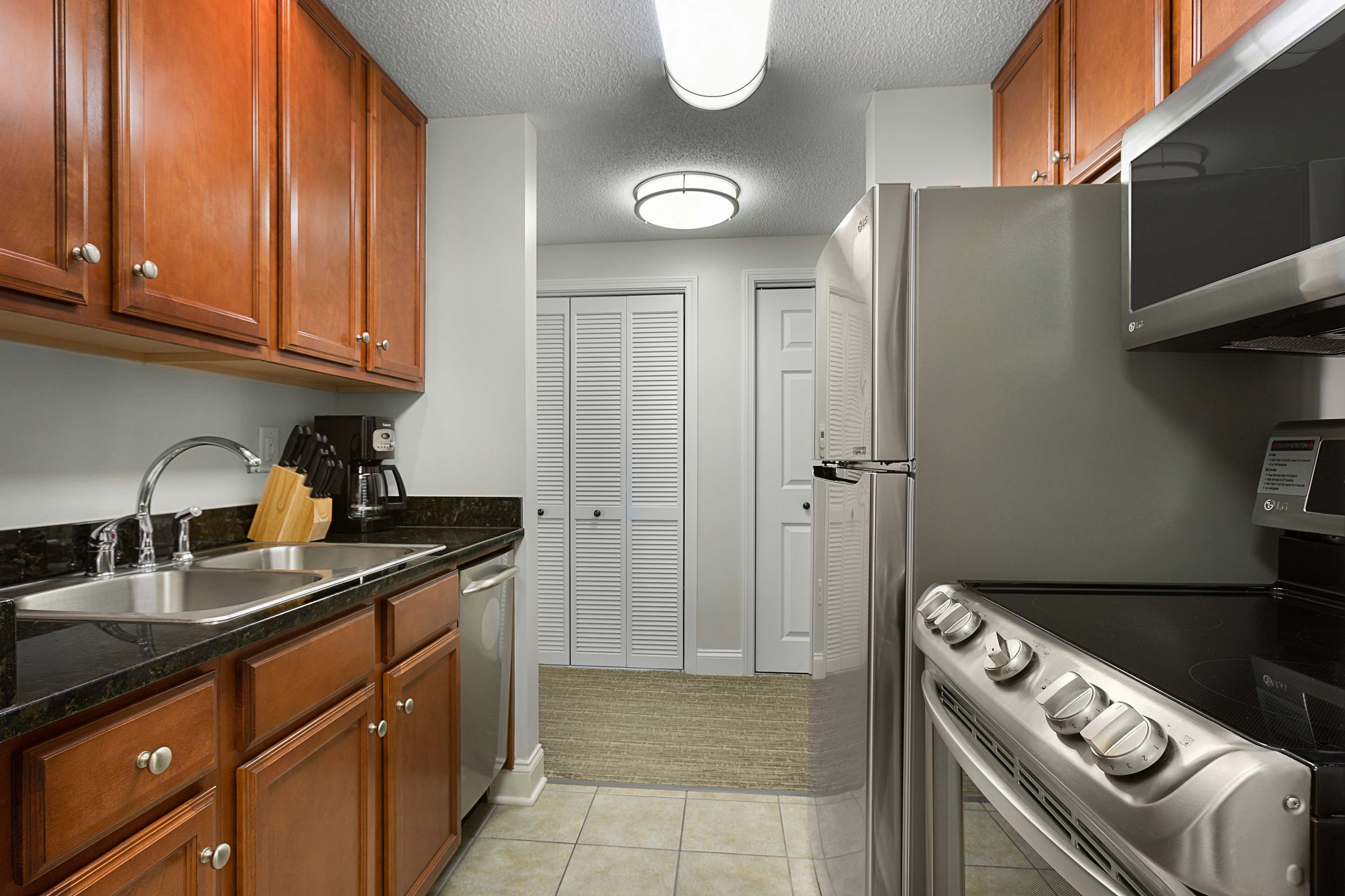 full-sized fridge, microwave, stovetop, dishwasher