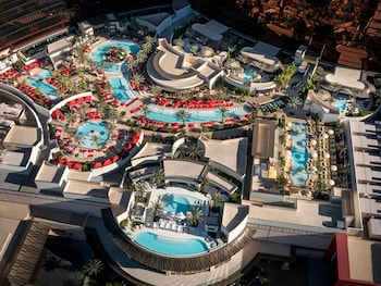 7 outdoor pools, open 9:00 AM to 4:00 PM, cabanas (surcharge) at Crockfords Las Vegas, LXR Hotels & Resorts at Resorts World