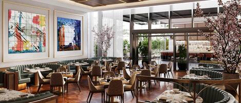 A spacious restaurant with high ceilings, modern lighting, and large windows.