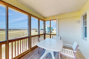 Enjoy dining or socializing on the covered porch with a view of the surrounding neighborhood.