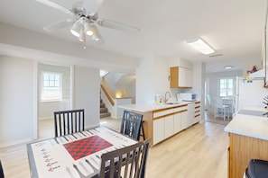 Enjoy a spacious kitchen with a central island and dining area for two.