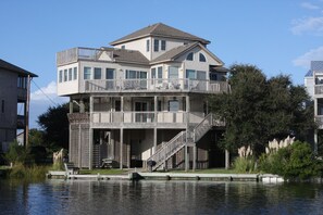 Enjoy a scenic waterfront view from the upper-level balcony, perfect for relaxation or dining.