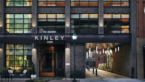 A modern building with the name "KINLEY" and the number "1409" on the facade. - Kinley Chattanooga Southside, a Tribute Portfolio Hotel (Chattanooga)