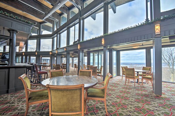 Enjoy meals in this elegant dining area with a large round table and comfortable seating.