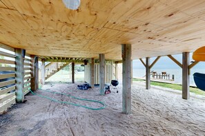 Enjoy al fresco dining and stunning ocean views from this beachside retreat's outdoor seating area.