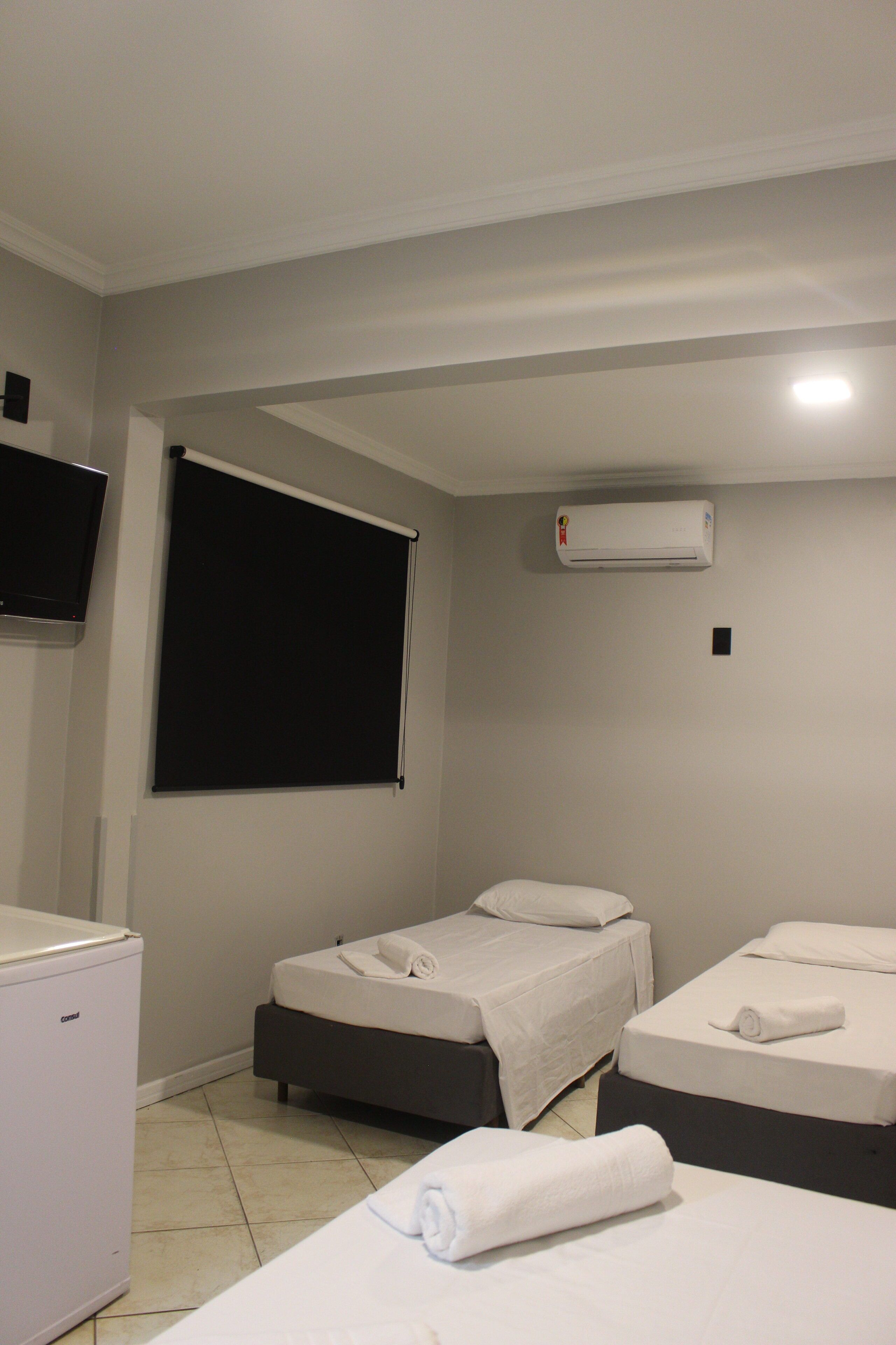 Quarto família | Frigobar, Wi-Fi de cortesia, roupa de cama