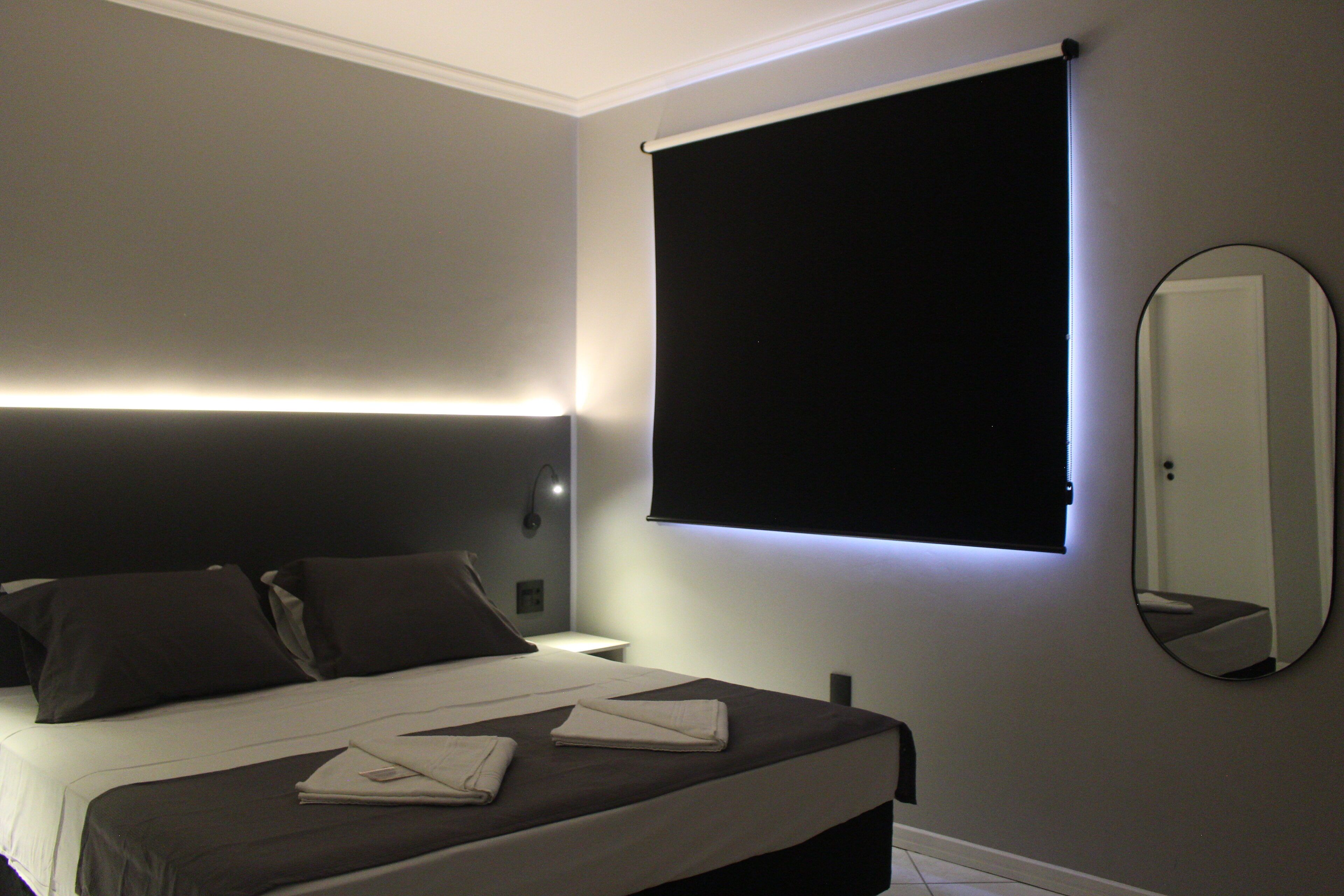 Deluxe Room, Partial Sea View | Minibar, free WiFi, bed sheets