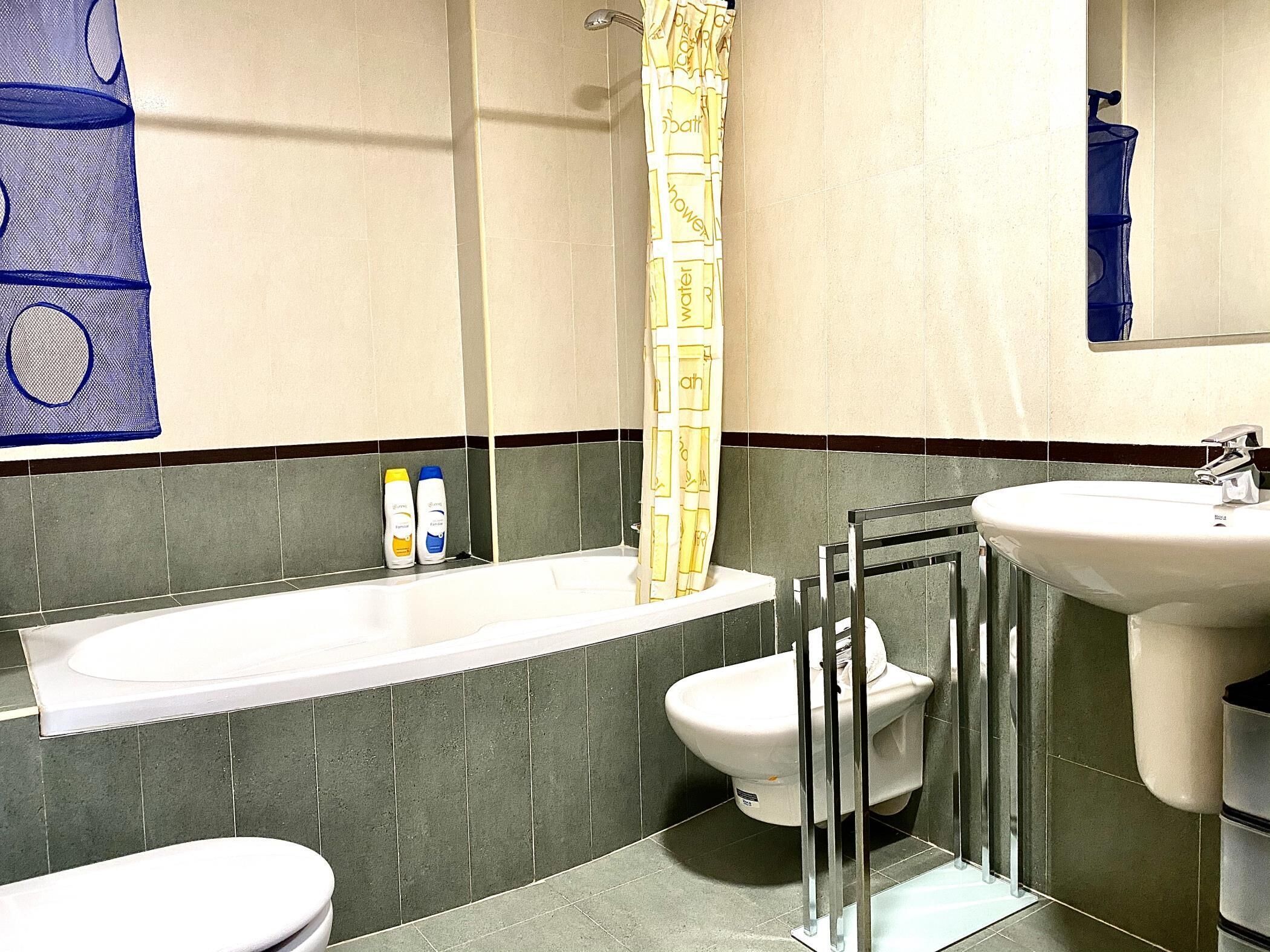 Bathtub, hair dryer, towels