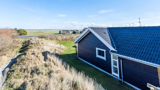 Hus | Utsikt mot vann