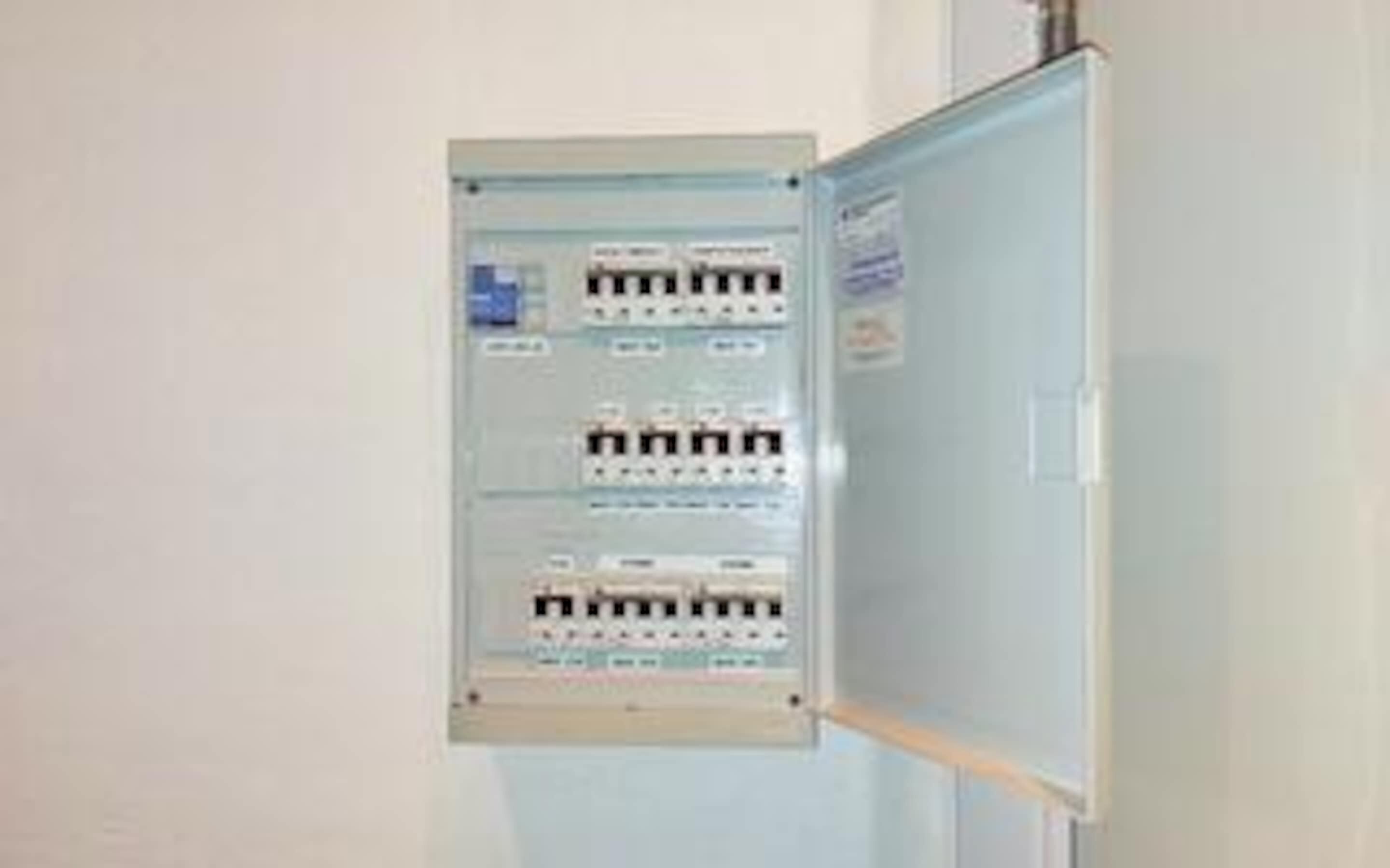 An electrical panel with multiple switches and indicators.