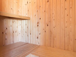 A wooden room with a slatted floor and a wooden shelf. - 4 Star Holiday Home in Fano (Fano)