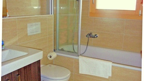 A bathroom with a toilet, sink, shower, and a window. - Lavish Holiday Home in Heremence With Balcony (Heremence)