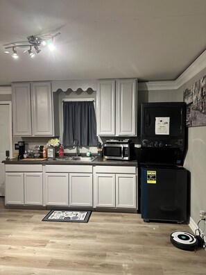 Fridge, microwave, stovetop, coffee/tea maker