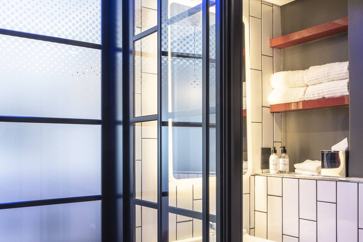 shower, rainfall showerhead, hair dryer, towels